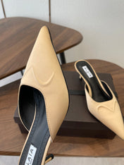 ALAIA 26S HEELED MULES 50 MM IN WARM BEIGE FABRIC