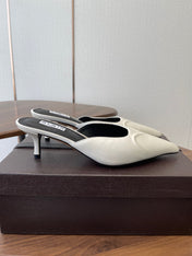ALAIA 26S HEELED MULES 50 MM IN WHITE FABRIC