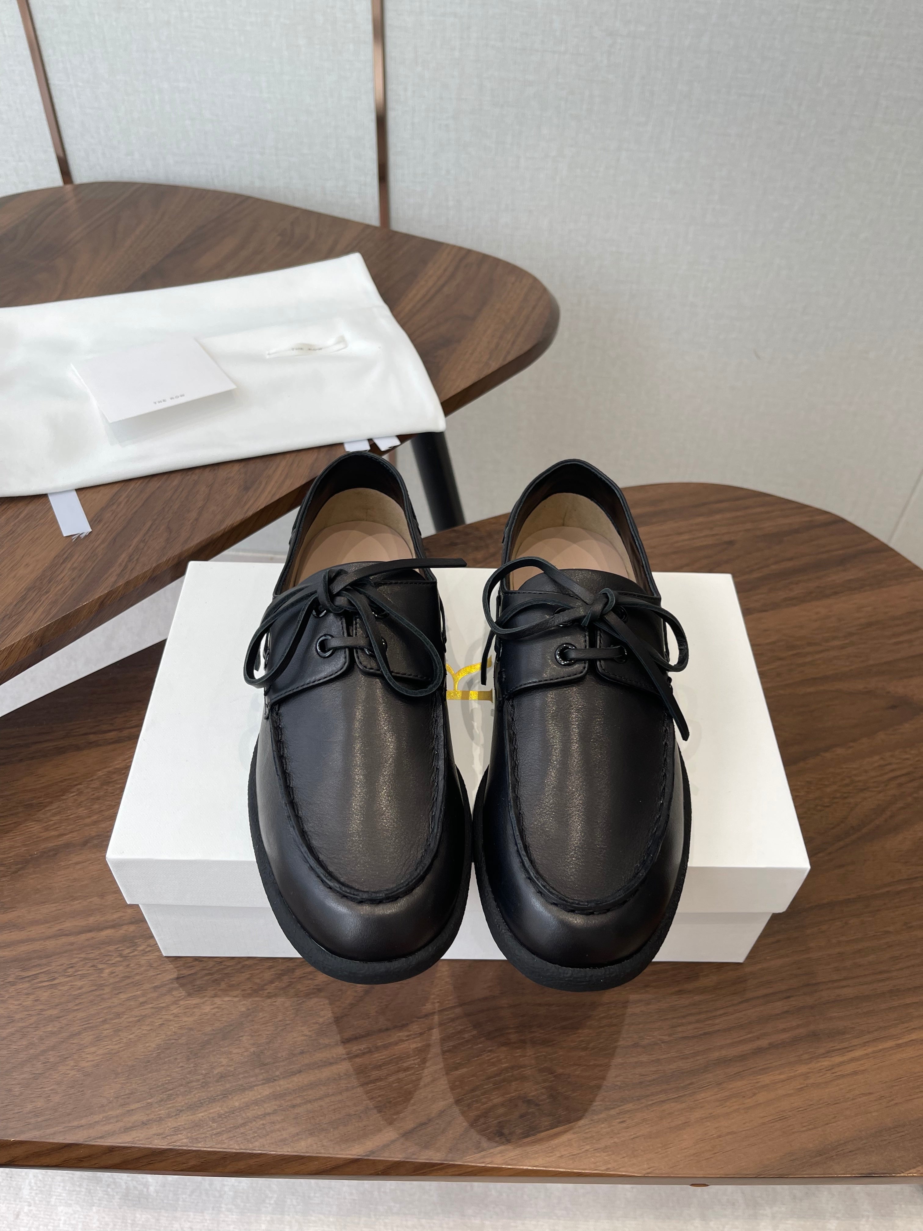 THE ROW 26S LOAFERS IN BLACK CALFSKIN