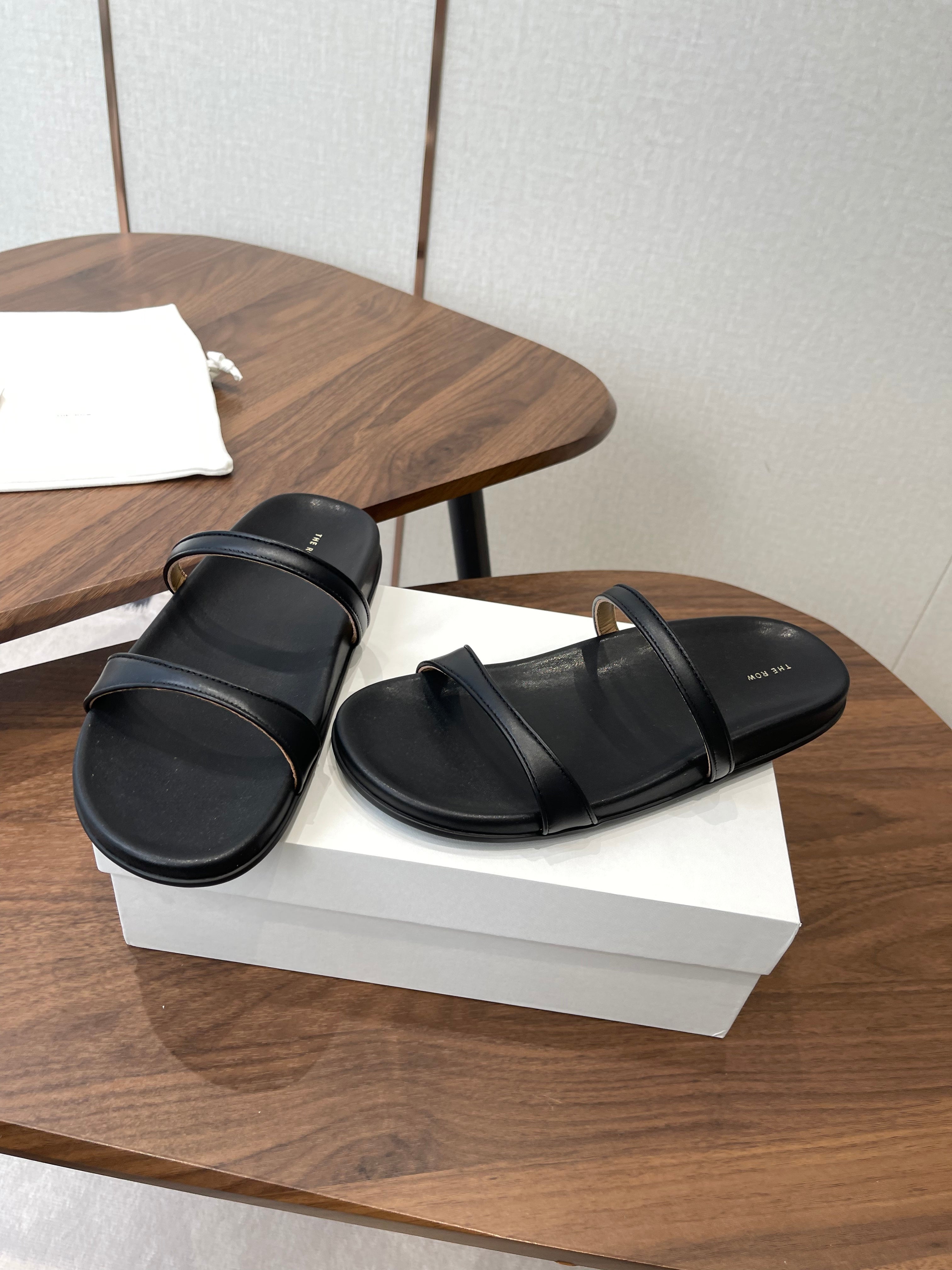 THE ROW 26S DOUBLE STRAP FLAT SANDALS IN BLACK CALFSKIN