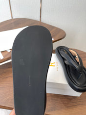 THE ROW 26S PUFFED THONG SANDALS IN BLACK CALFSKIN