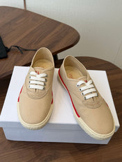 CELINE 26S TRIOMPHE LOW TOP SNEAKERS IN BEIGE CANVAS RED TRIM