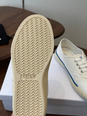 CELINE 26S TRIOMPHE LOW TOP SNEAKERS IN WHITE CANVAS BLUE TRIM
