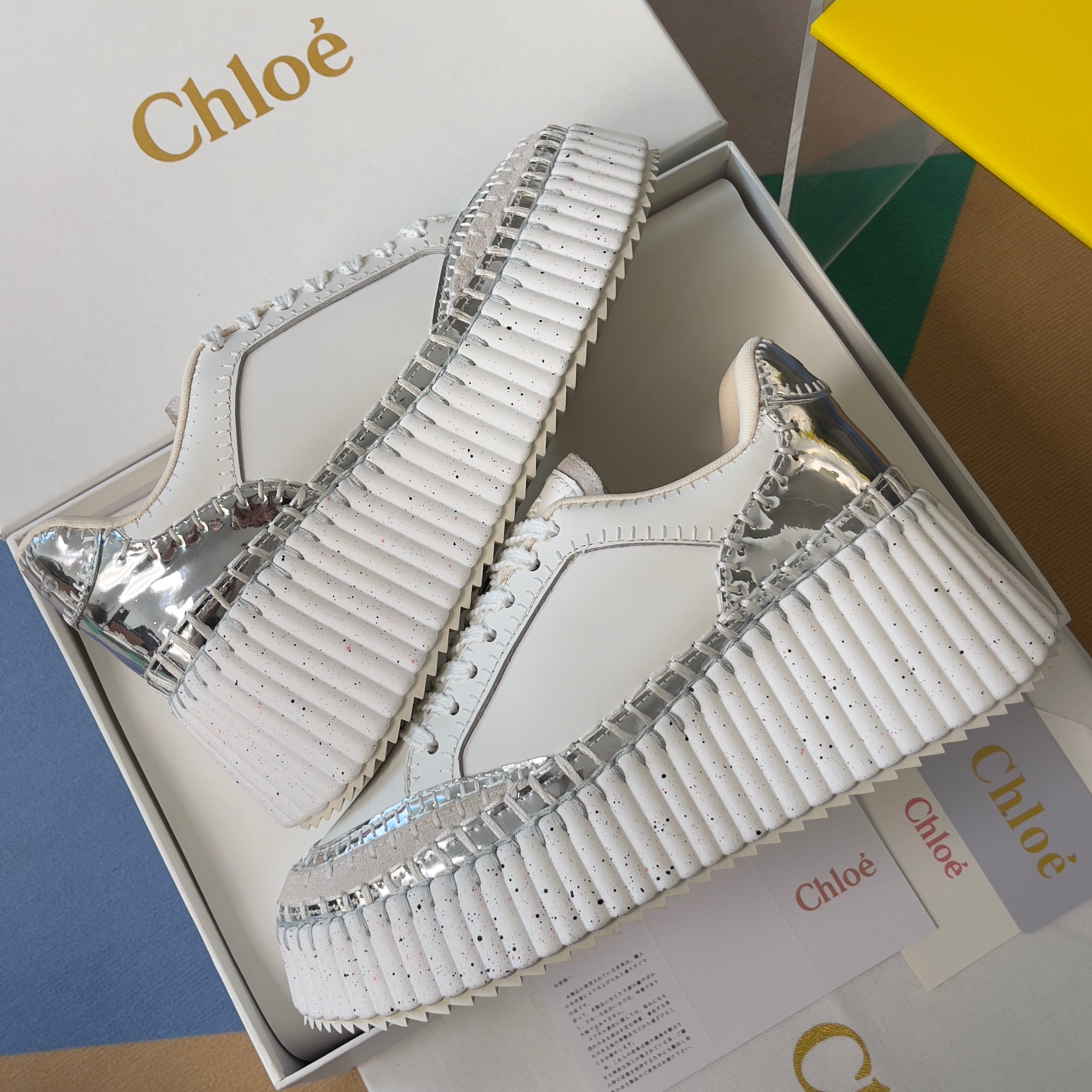 CHLOÉ 26S WEDGE SNEAKERS 70 MM IN WHITE AND SILVER CALFSKIN