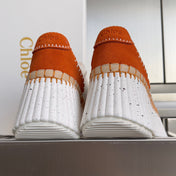 CHLOÉ 26S WEDGE SNEAKERS 70 MM IN WHITE CALFSKIN AND ORANGE SUEDE