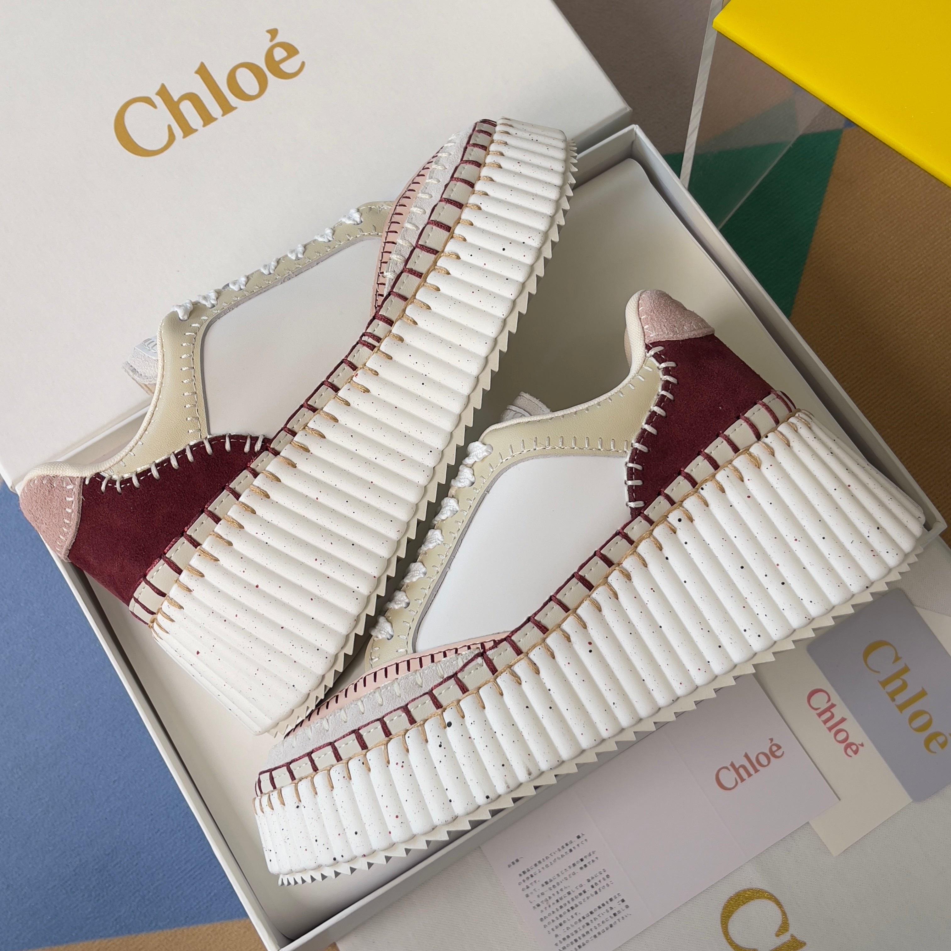 CHLOÉ 26S WEDGE SNEAKERS 70 MM IN WHITE CALFSKIN AND DARK RED SUEDE