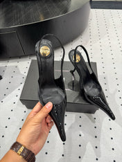 YSL 26S POINTED-TOE SLINGBACK HEELS 105 MM IN BLACK PATENT CALFSKIN