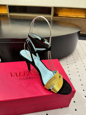 VLTN HIGH SANDAL 25S 60 MM IN BLACK SUEDE AND GOLD CALFSKIN