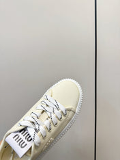 MIUMIU 26S SNEAKER MULES IN LIGHT YELLOW CANVAS