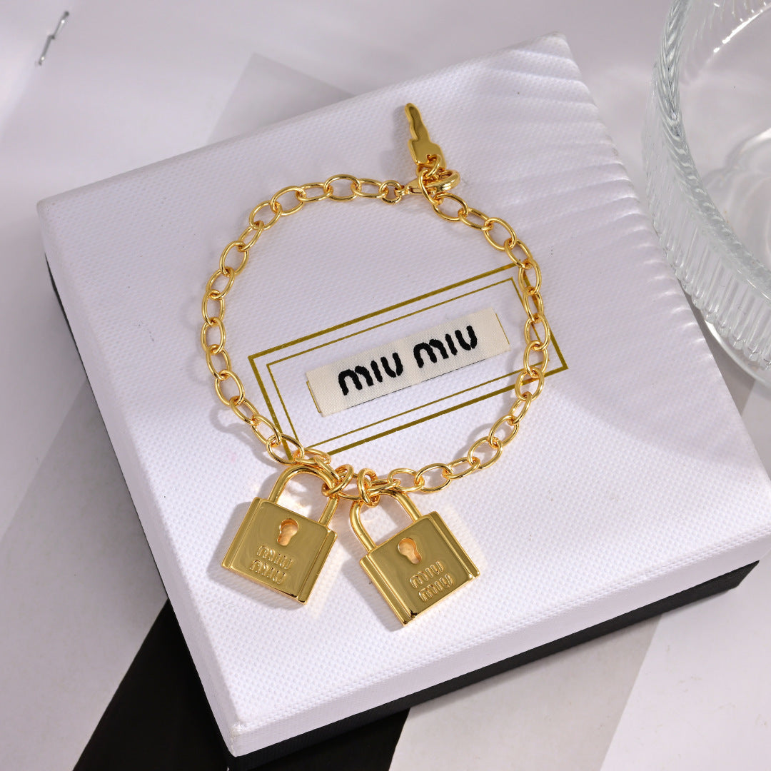 MIUMIU 26S DOUBLE PADLOCK CHARM CHAIN BRACELET IN GOLD TONE METAL 619260