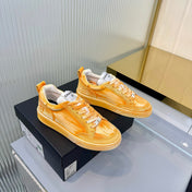 CHANEL 26S LOW-TOP SNEAKERS IN GOLDEN ORANGE CALFSKIN