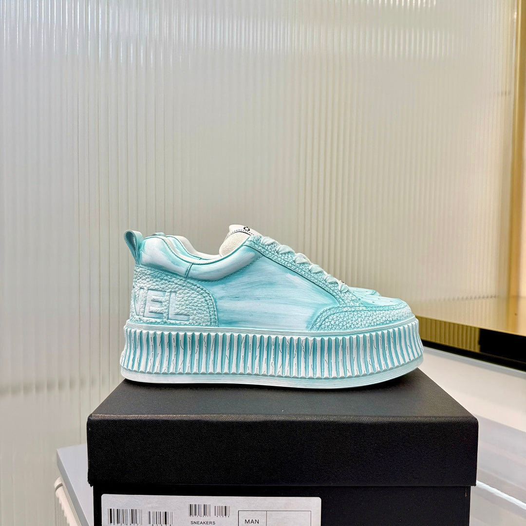 CHANEL 26S LOW-TOP SNEAKERS IN LIGHT MINT BLUE GRAFFITI PATTERN CALFSKIN