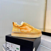 CHANEL 26S LOW-TOP SNEAKERS IN GOLDEN ORANGE GRAFFITI PATTERN CALFSKIN