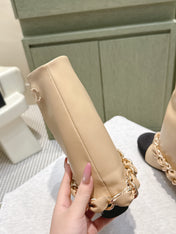 CHANEL 25S CALF-LENGTH BOOTS 45MM IN BEIGE AND BLACK CALFSKIN GOLD HARDWARE