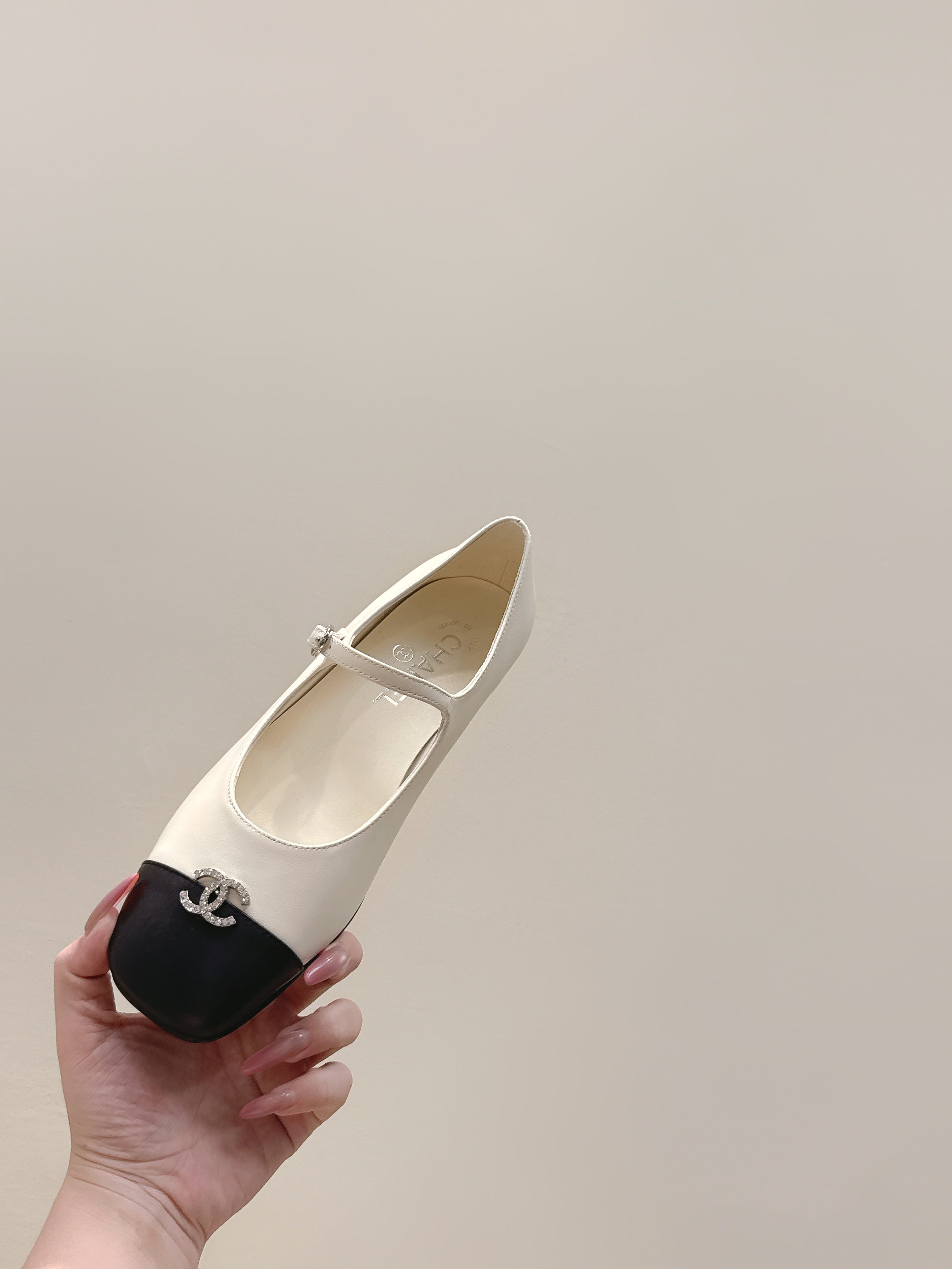 CHANEL 25S MARY JANE FLATS IN IVORY LAMBSKIN WITH BLACK CAP TOE SILVER HARDWARE