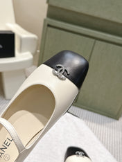 CHANEL 25S MARY JANE FLATS IN IVORY LAMBSKIN WITH BLACK CAP TOE SILVER HARDWARE