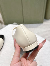 CHANEL 25S MARY JANE FLATS IN IVORY LAMBSKIN WITH BLACK CAP TOE SILVER HARDWARE