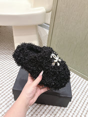 CHANEL 25S CLASSIC FURRY SLIDES IN BLACK WITH DOUBLE C LOGO