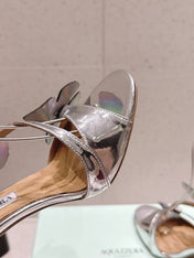 AQUAZZURA 26S BUTTERFLY HEEL SANDALS 100 MM IN SILVER CALFSKIN