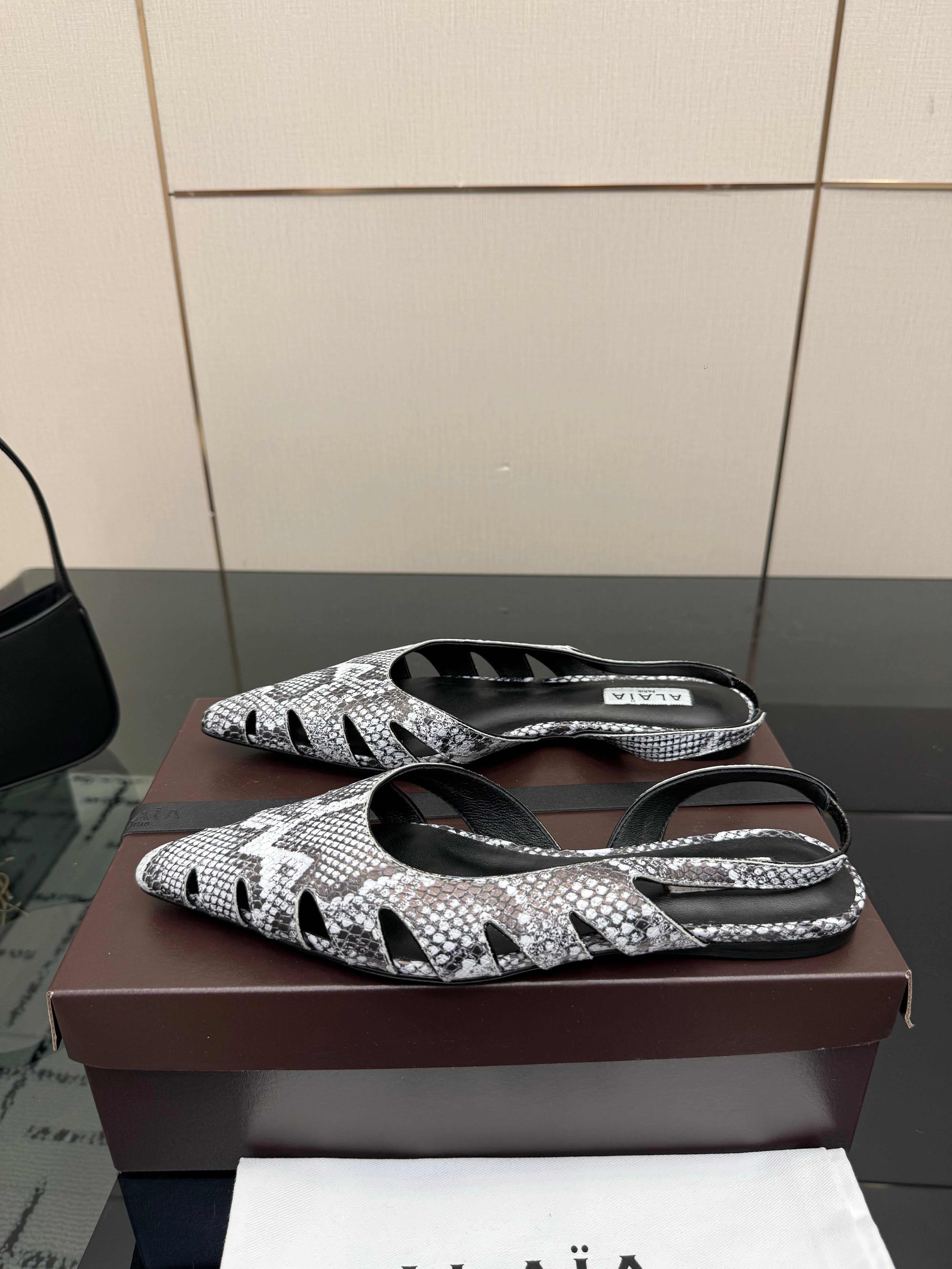 ALAIA 26S CUT-OUT SLINGBACK FLATS IN PYTHON-EMBOSSED LEATHER