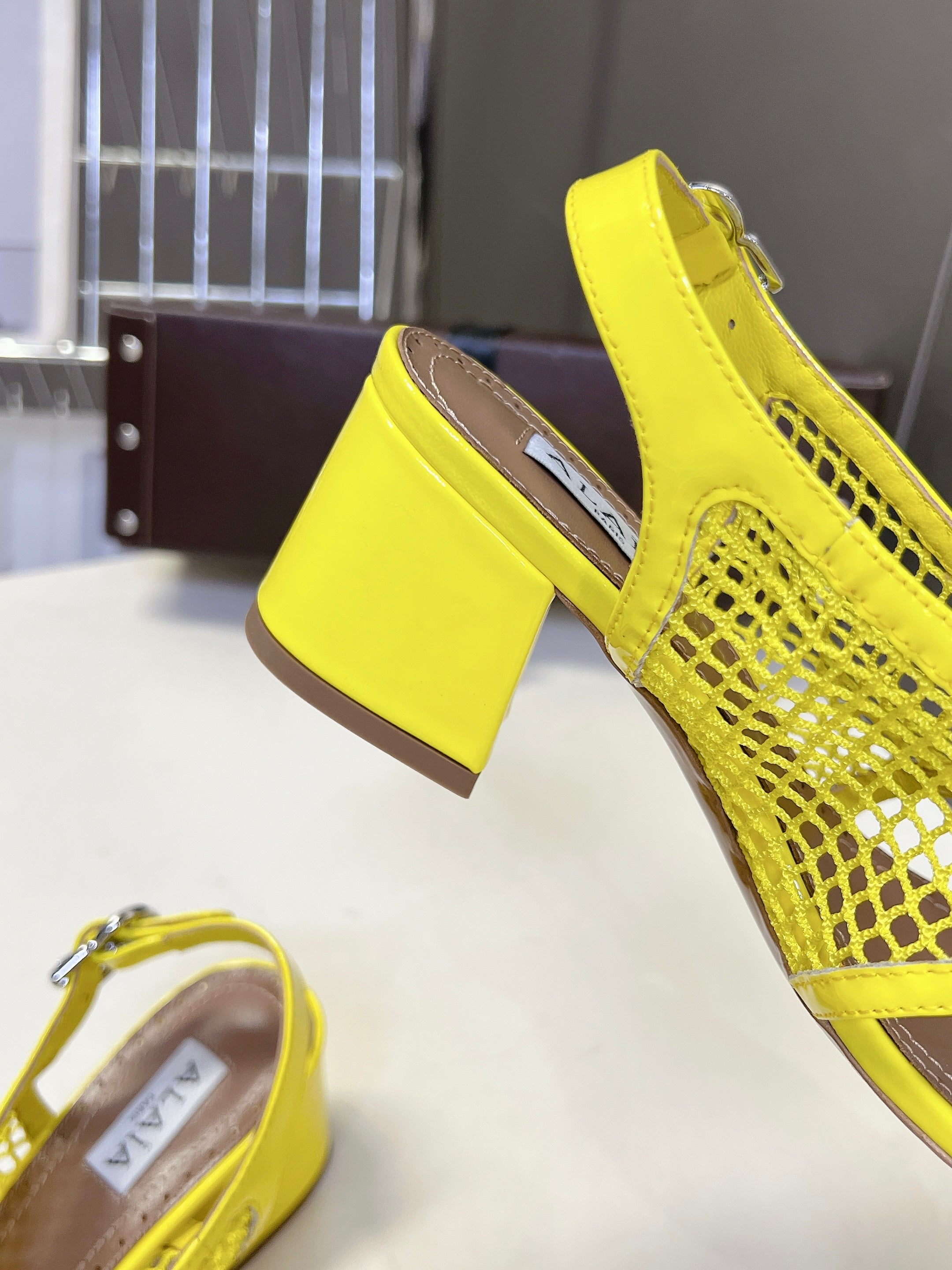 ALAIA 26S MESH THONG HEELS 55 MM IN YELLOW PATENT CALFSKIN
