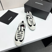 CHANEL SNEAKERS METIERS D-ART 26S IN BLACK AND WHITE SUEDE