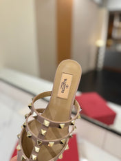 VALENTINO 26S STUDDED FLAT MULES IN NUDE PATENT CALFSKIN