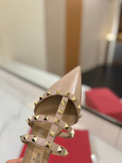 VALENTINO 26S STUDDED FLAT MULES IN NUDE PATENT CALFSKIN