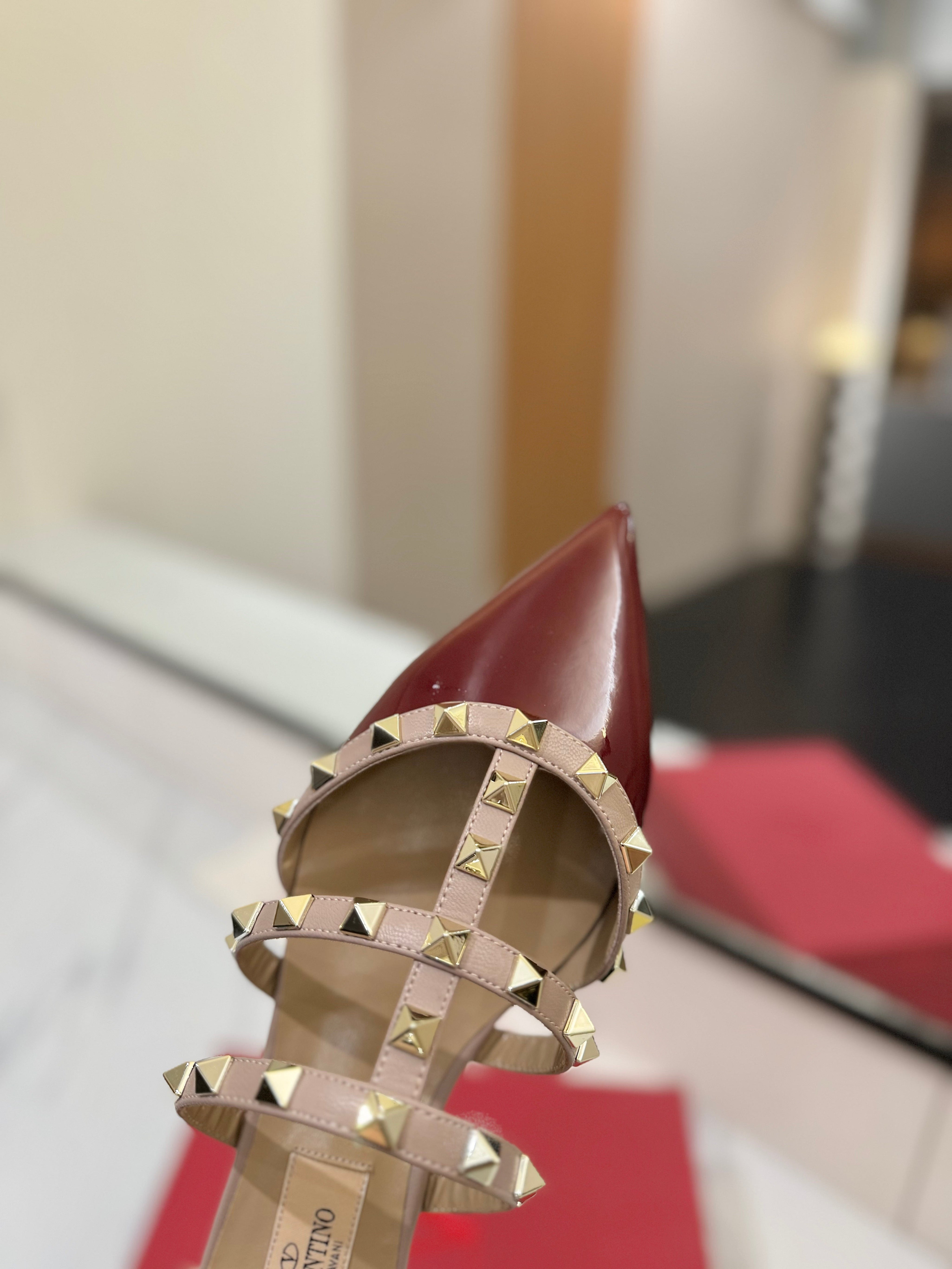 VALENTINO 26S STUDDED FLAT MULES IN DARK RED PATENT CALFSKIN