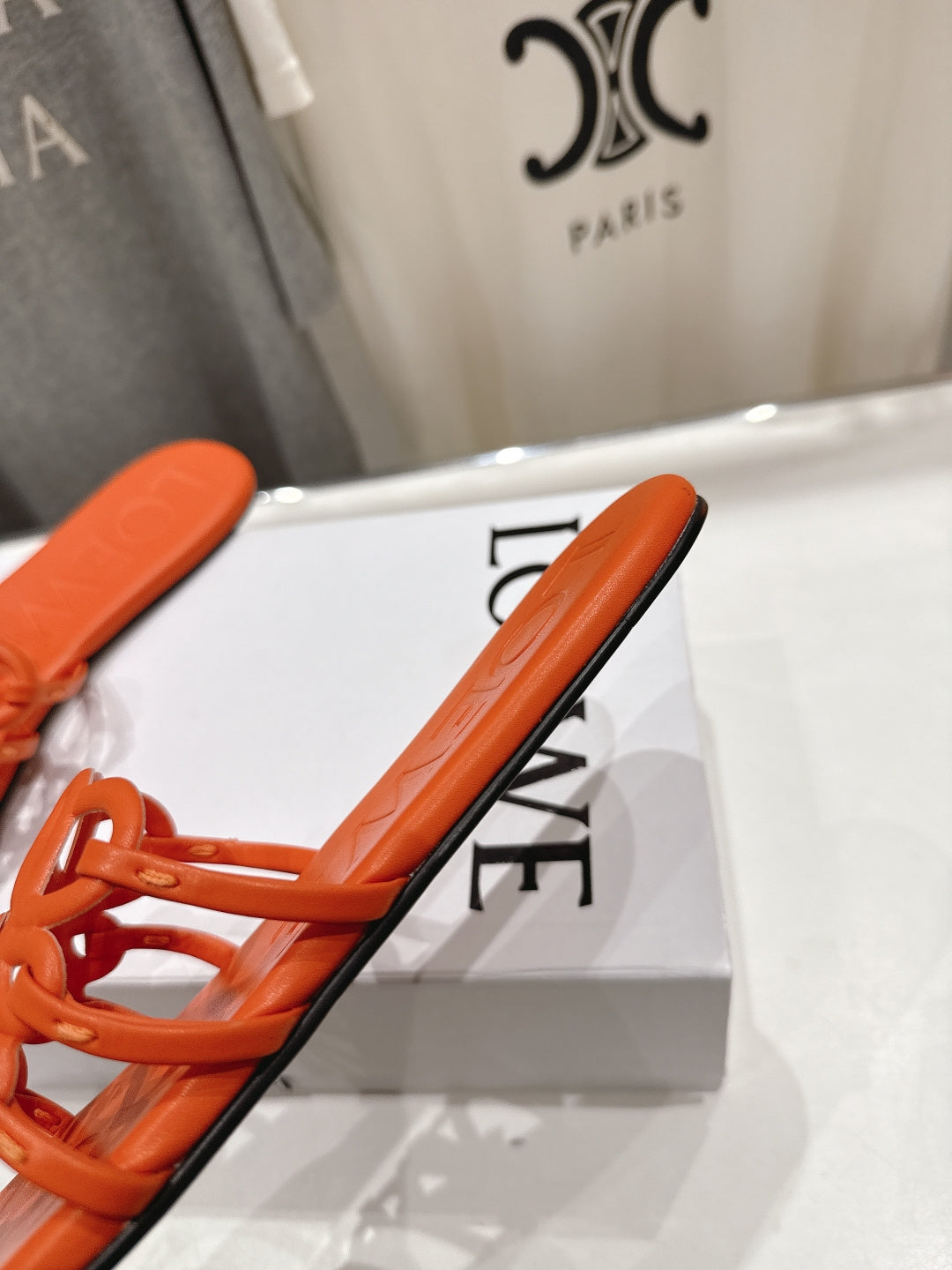 LOEWE 26S PETAL ANAGRAM SLIDE IN BURNT ORANGE CALFSKIN