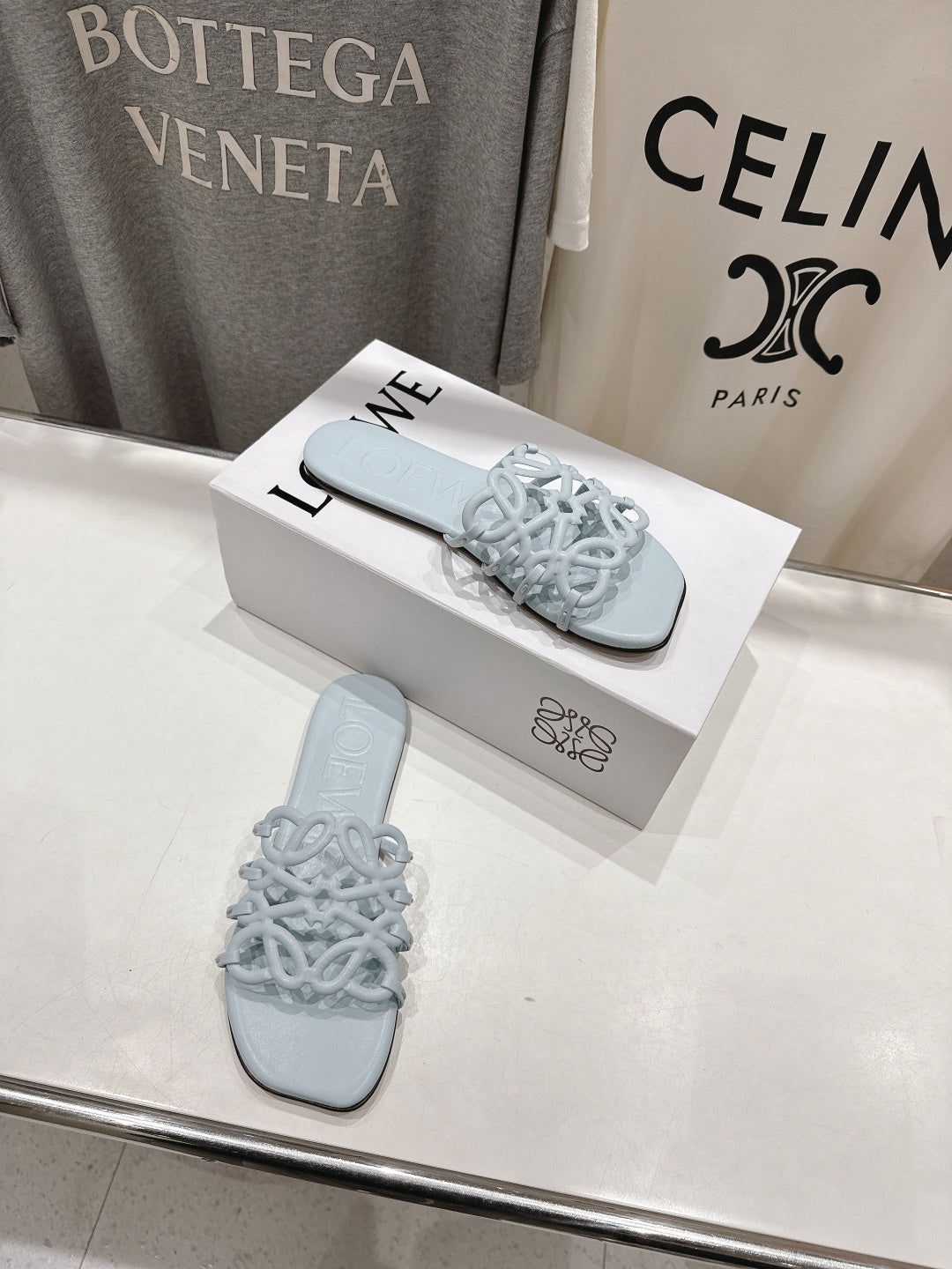 LOEWE 26S PETAL ANAGRAM SLIDE IN LIGHT BLUE CALFSKIN