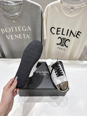 PRADA 25S MULES IN WHITE WITH METAL TOECAP