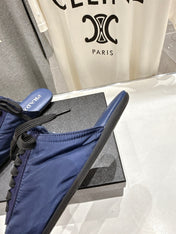 PRADA 25S MULES IN DARK BLUE WITH METAL TOECAP