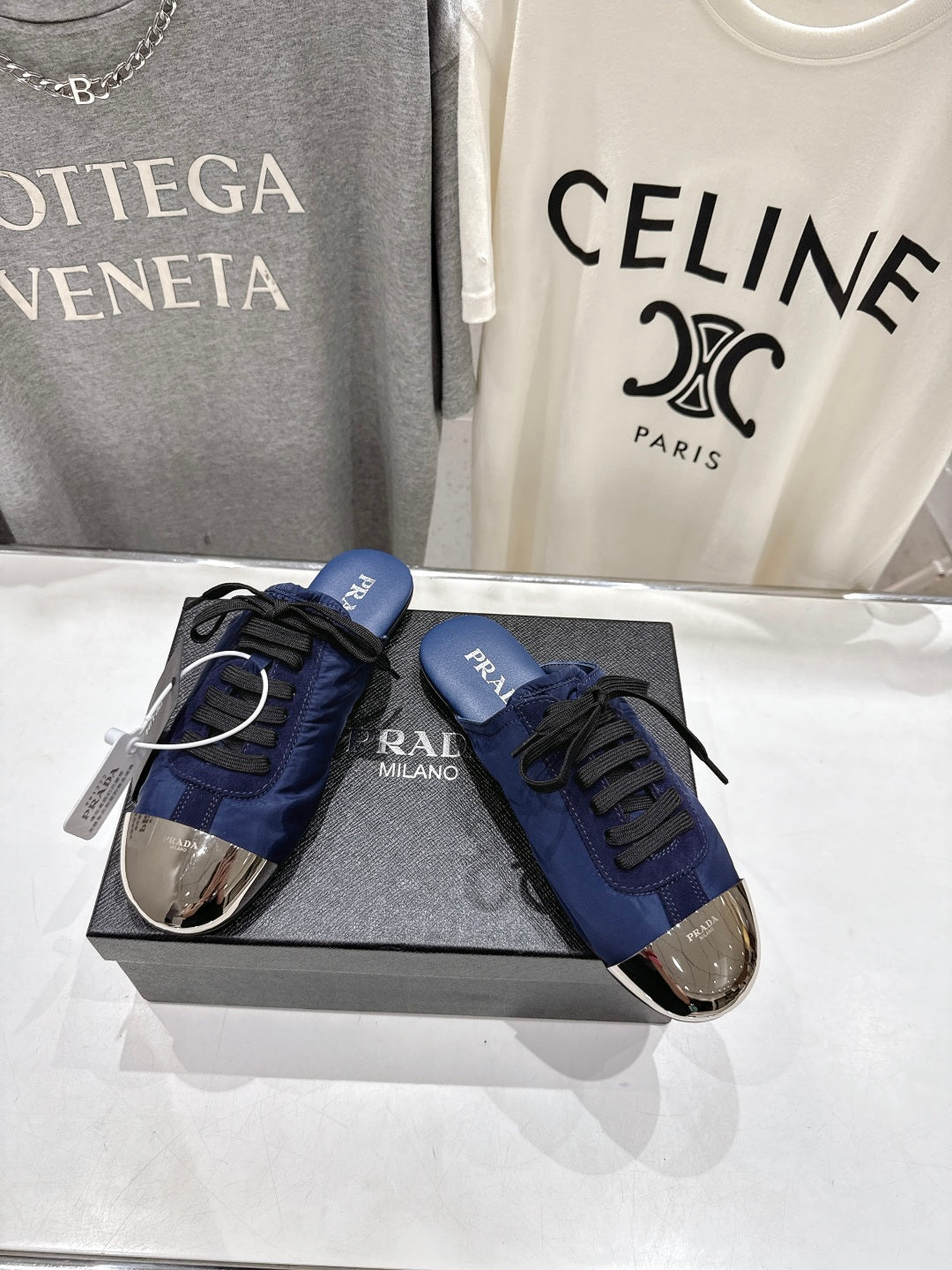 PRADA 25S MULES IN DARK BLUE WITH METAL TOECAP