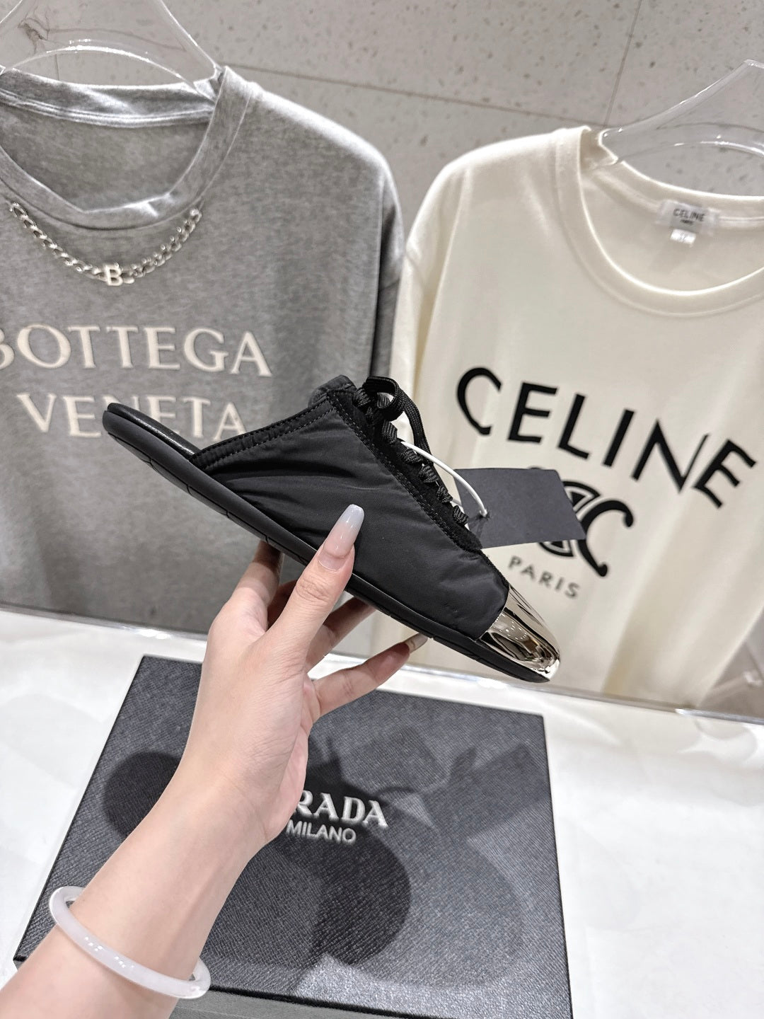 PRADA 25S MULES IN BLACK WITH METAL TOECAP