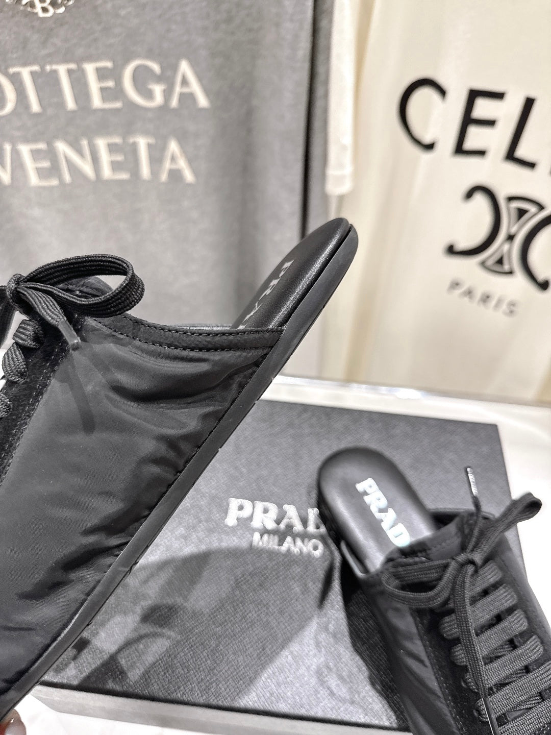 PRADA 25S MULES IN BLACK WITH METAL TOECAP