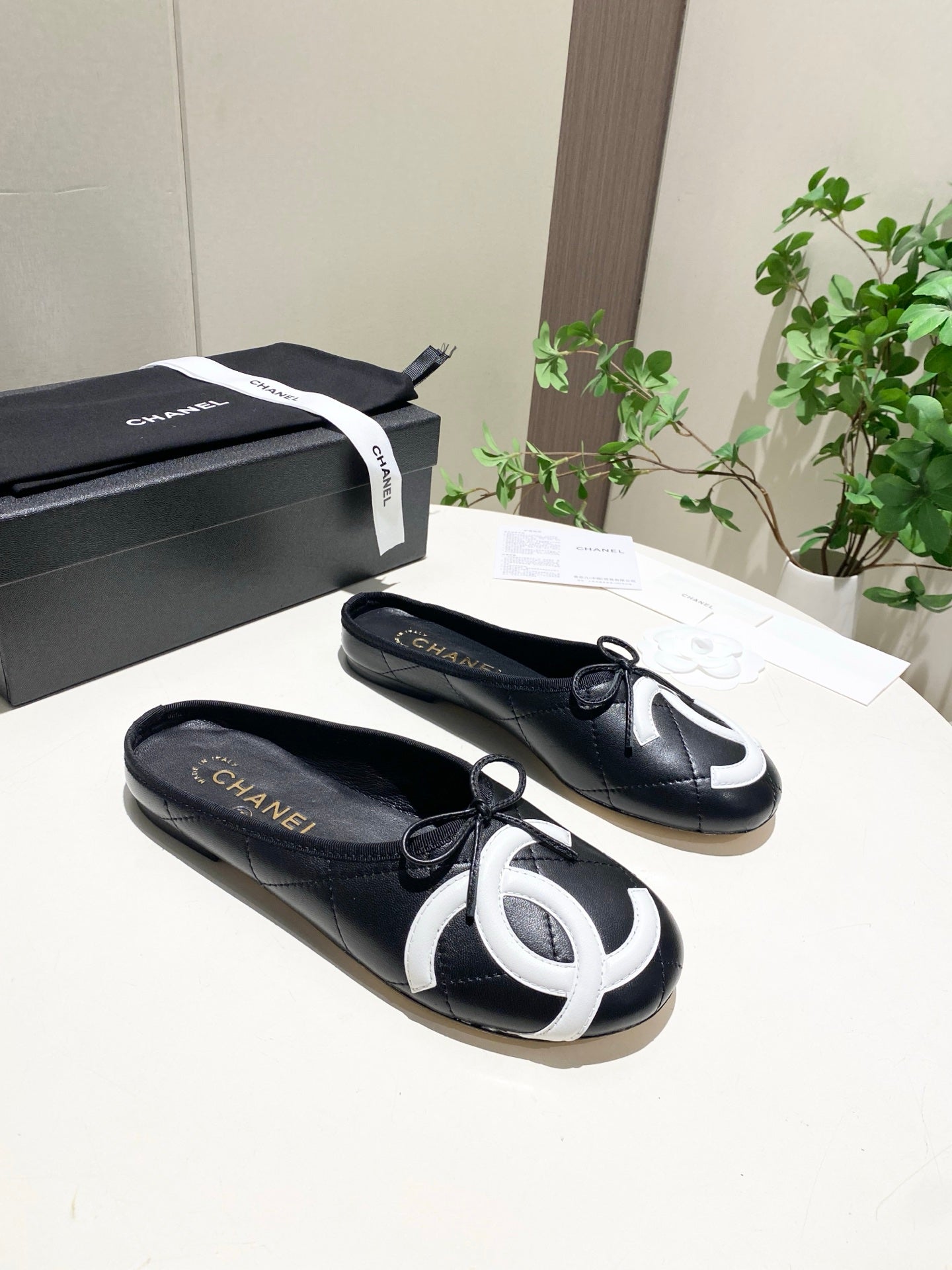 CHANEL 26S FLAT MULES IN BLACK LAMBSKIN