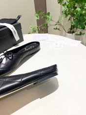 CHANEL 26S FLAT MULES IN BLACK LAMBSKIN