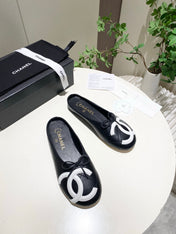CHANEL 26S FLAT MULES IN BLACK LAMBSKIN