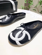 CHANEL 26S FLAT MULES IN BLACK LAMBSKIN