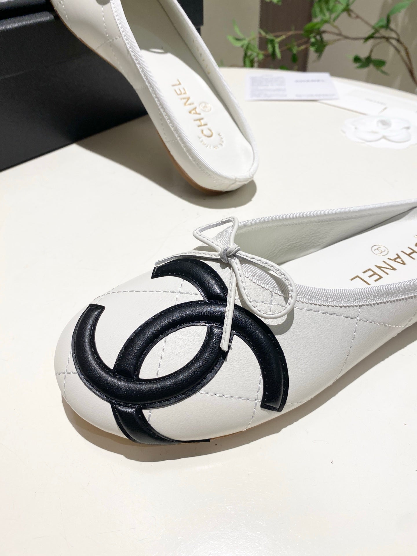 CHANEL 26S FLAT MULES IN WHITE LAMBSKIN
