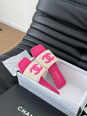 WOVEN SLIDE IN RAFFIA AND BRIGHT PINK LAMBSKIN