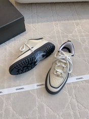 CHANEL 25S TRAINERS 40MM IN WHITE AND BLACK CALFSKIN