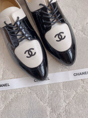 CHANEL 25S TWO TONE LACE UP IN BLACK AND WHITE SHINY CALFSKIN