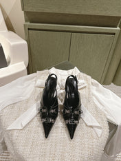CAGOLE HIGH SLINGBACK IN BLACK GLOSSY CALFSKIN