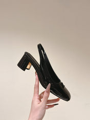 SWING SLINGBACK PUMP 55 MM IN BLACK PATENT CALFSKIN