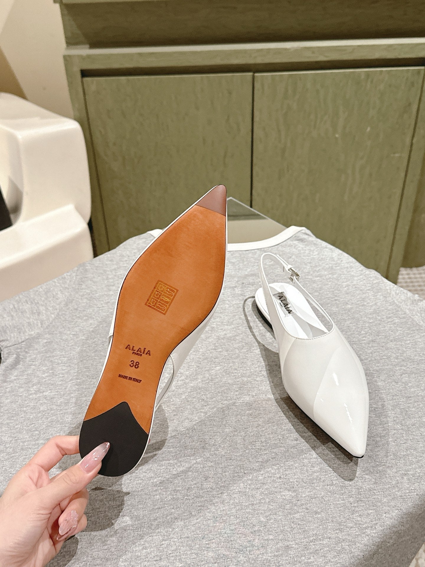 ALAIA SLINGBACK 25S IN WHITE PATENT LEATHER