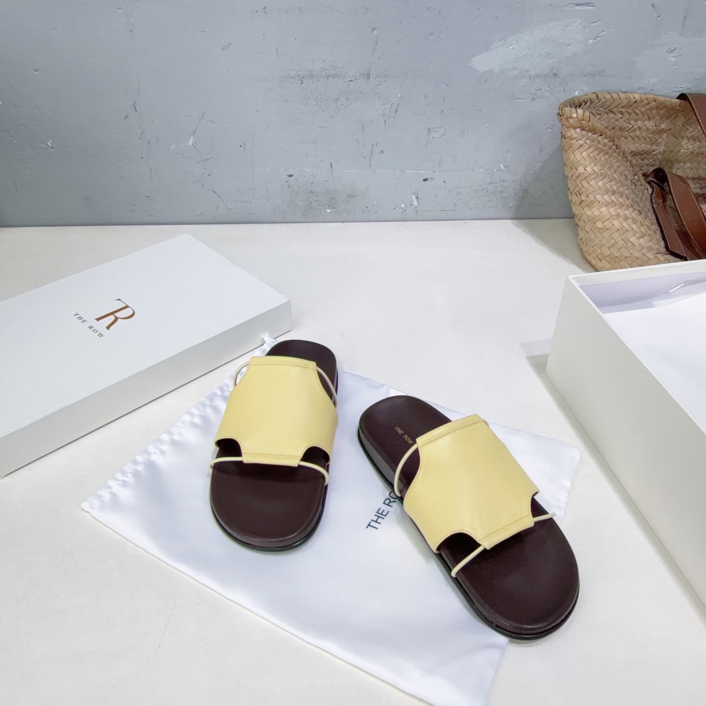 THE ROW 26S STRAP SLIDES IN LIGHT YELLOW CALFSKIN
