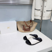 THE ROW 26S CROSS STRAP SLIDES IN IVORY WHITE CALFSKIN WITH BLACK FOOTBED