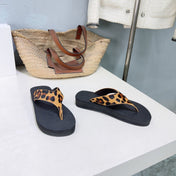 THE ROW 26S THONG SANDALS IN BLACK RUBBER WITH LEOPARD CALF HAIR STRAPS